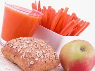 light breakfast - roll apple juice and fresh carrots